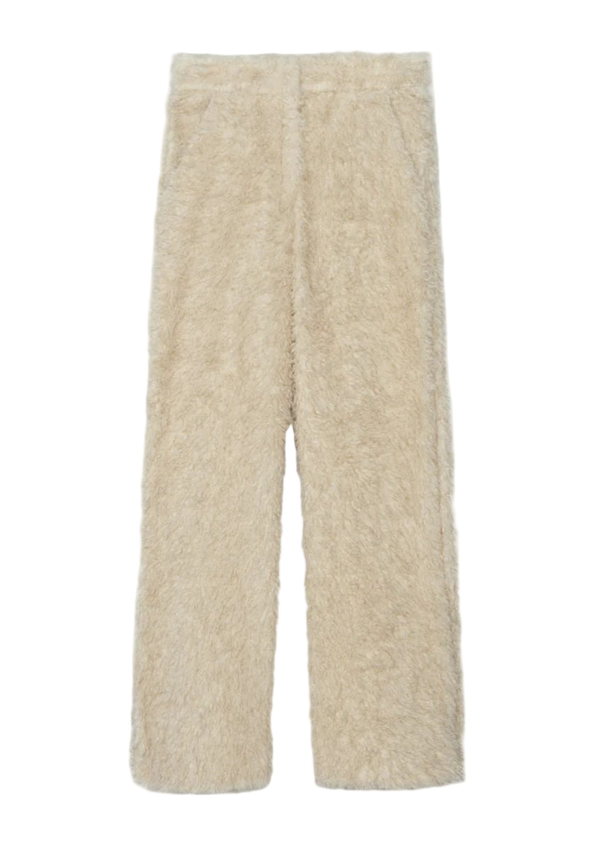Beige fuzzy pants on a white background