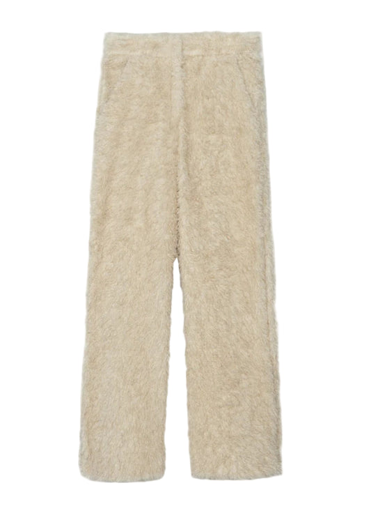 Beige fuzzy pants on a white background